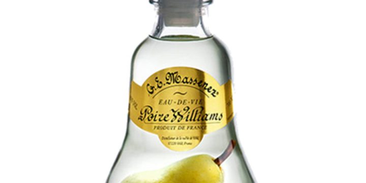 There is a full sized pear in a bottle of brandy. how does it get there?